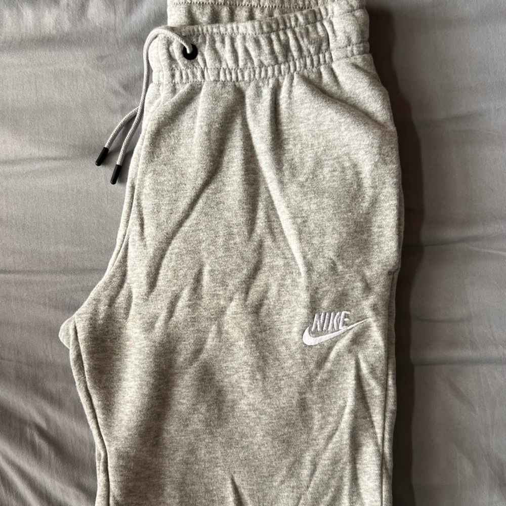 Women’s extra-small gray sweatpants by Nike.